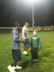 Kenjon Barner and Ed Dickson with Kanen Rossi